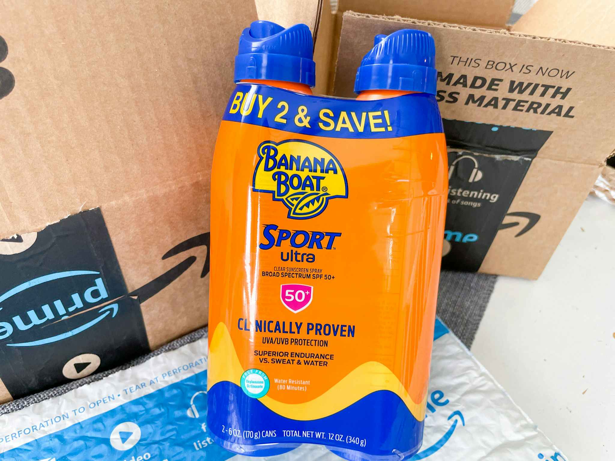 a two pack of banana boat sunscreen sitting in front of an amazon box