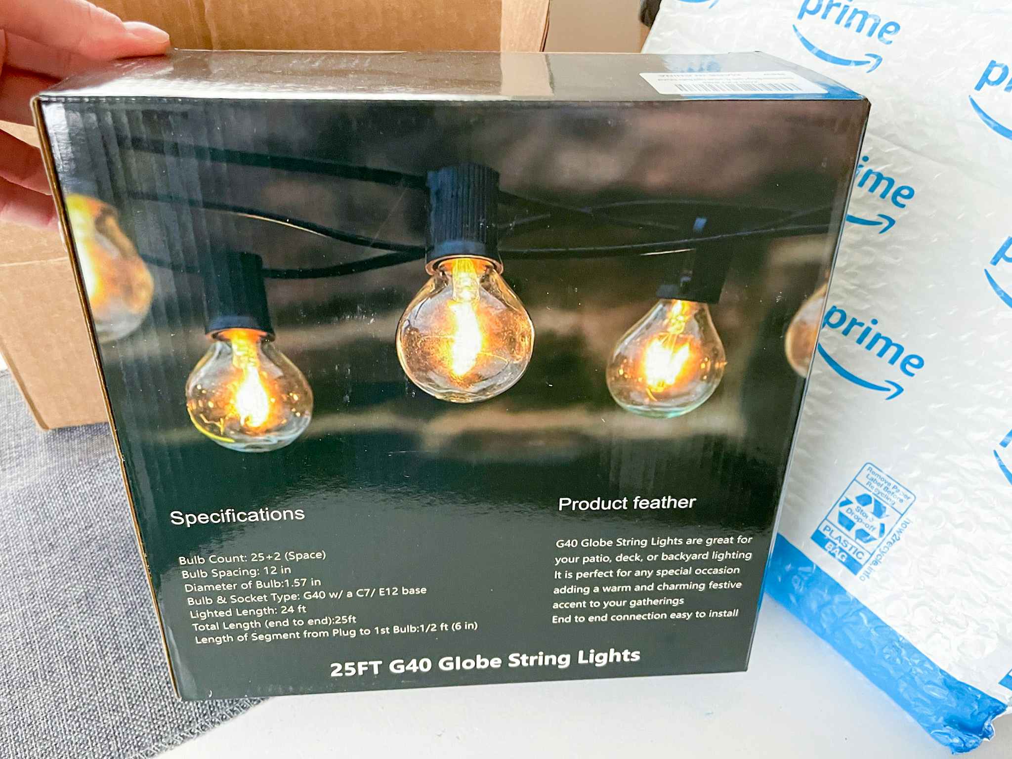 a box of string patio lights in front of an amazon package