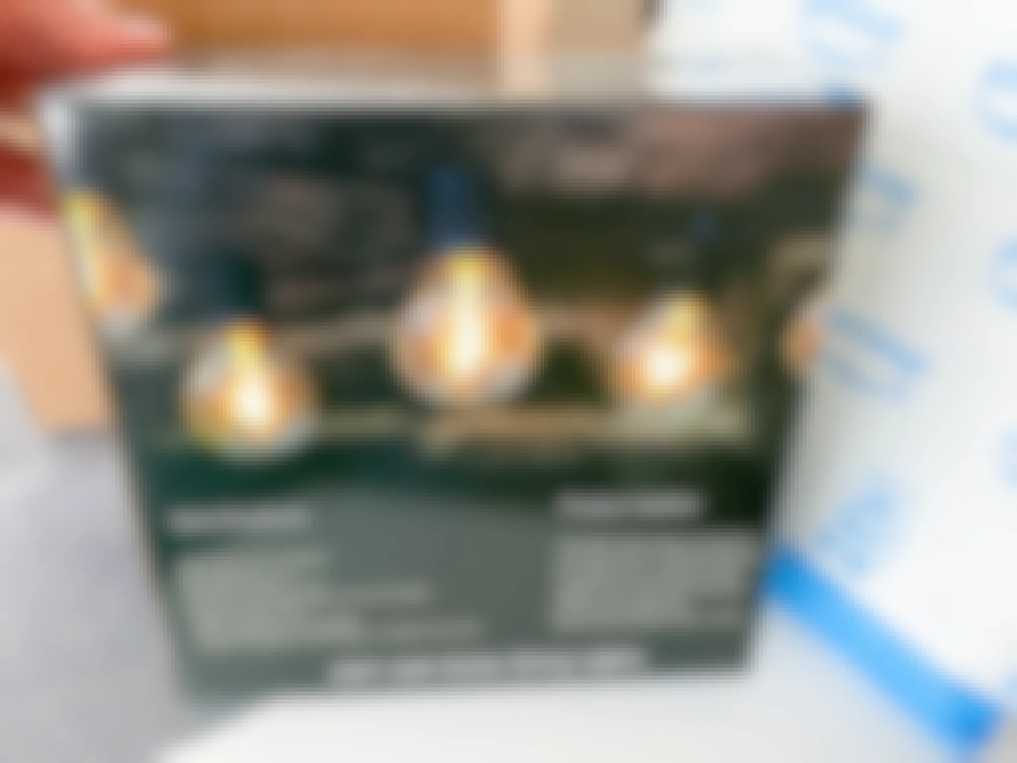 a box of string patio lights in front of an amazon package