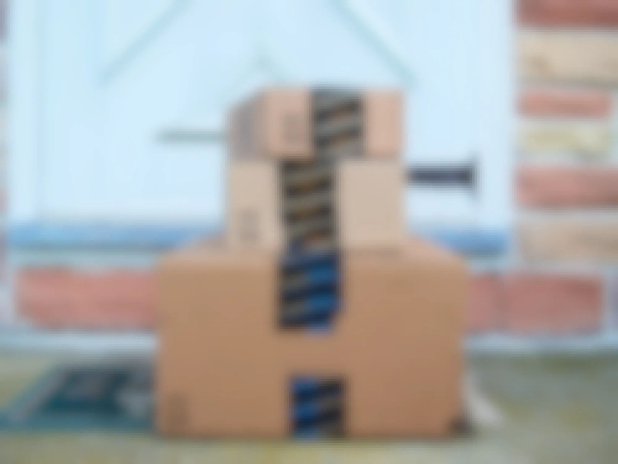 three amazon prime boxes stacked on top of each other