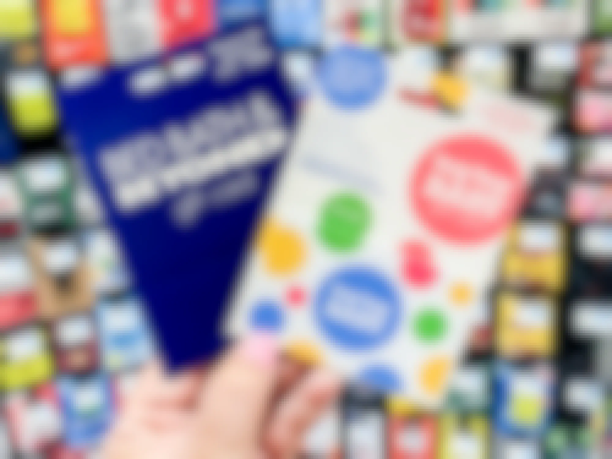 a person holding a buybuy baby and bed bath and beyond gift card