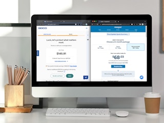 An iMac computer displaying a split screen of two similar car insurance policies from different companies