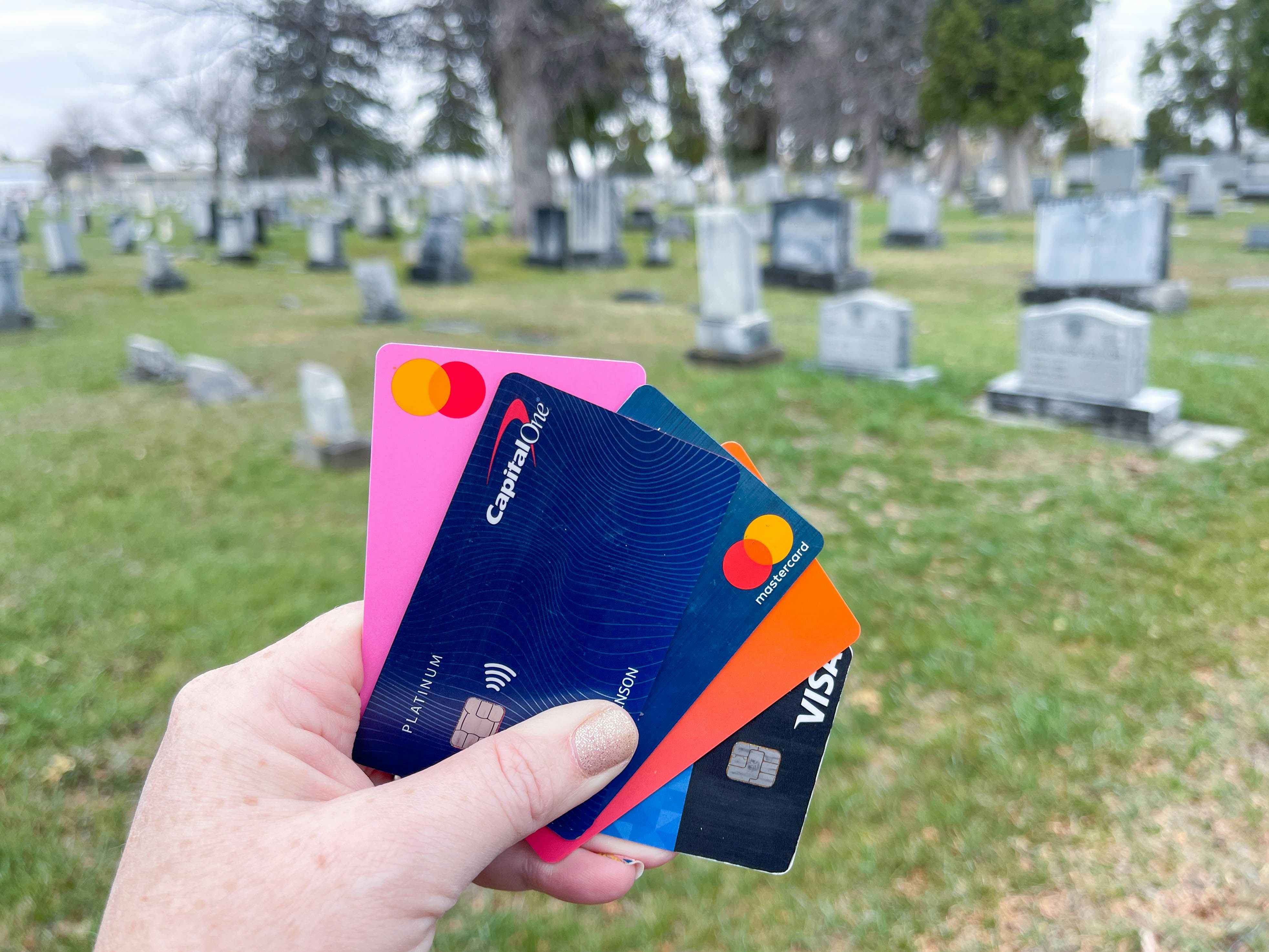 credit cards being held at a cemetery