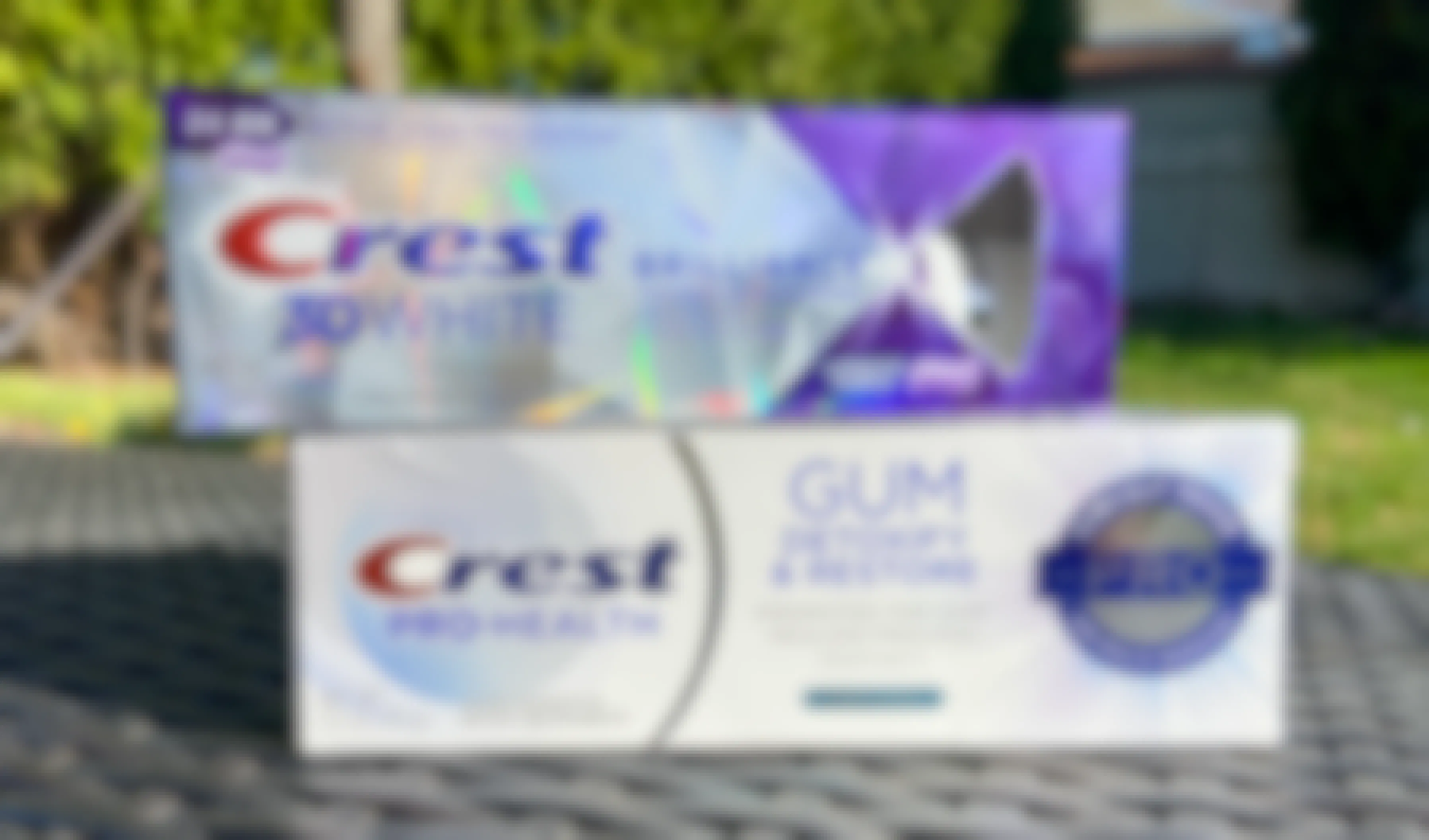 crest premium toothpaste on an outdoor table