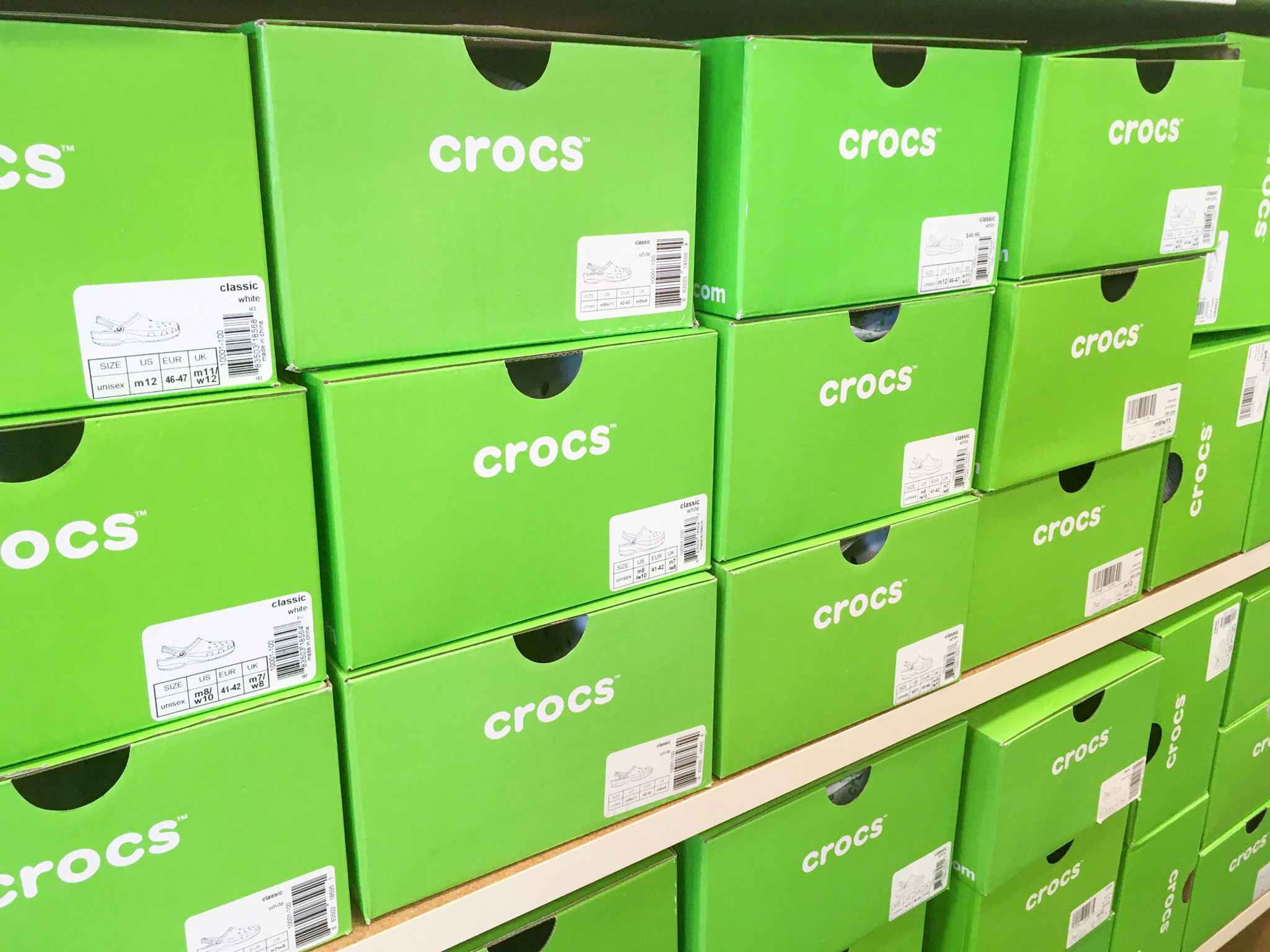 stacks of crocs shoe boxes