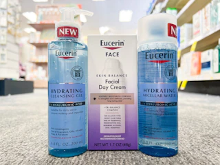 bottle of Eucerin hydrating cleansing gel, micellar water, and Skin Balance Day cream in aisle