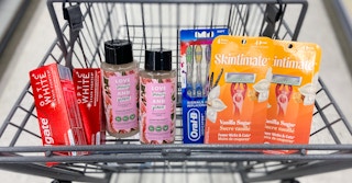 a cart with oral-b toothbrushes, skintimate razors, love beauty and planet hair care, and colgate toothpaste