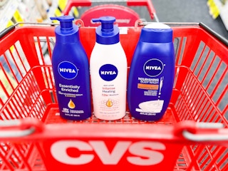 two bottles of Nivea body lotion and one bottle of body wash in shopping cart