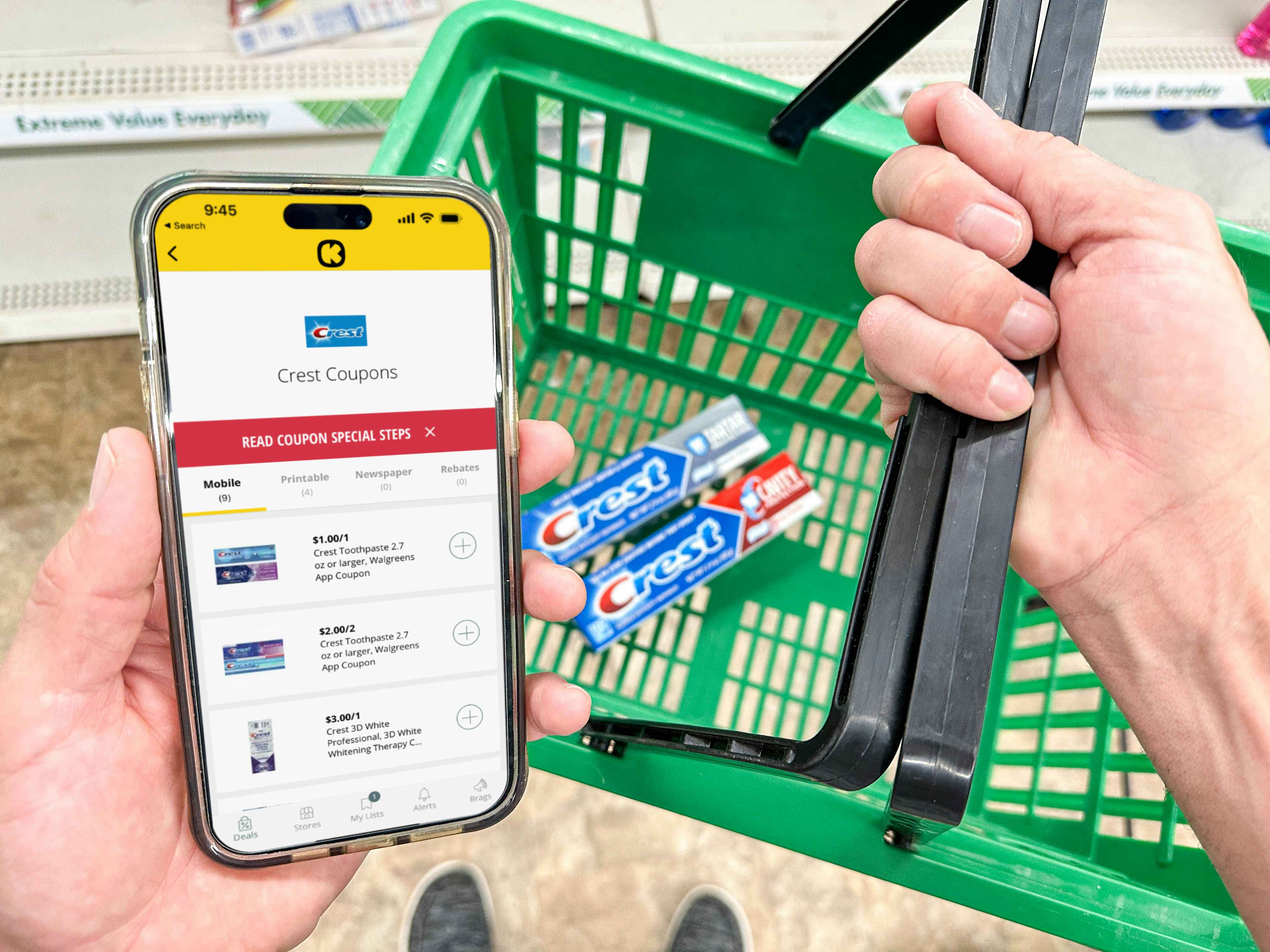 a person holding a dollar tree shopping basket holding a phone with crest toothpaste in basket 