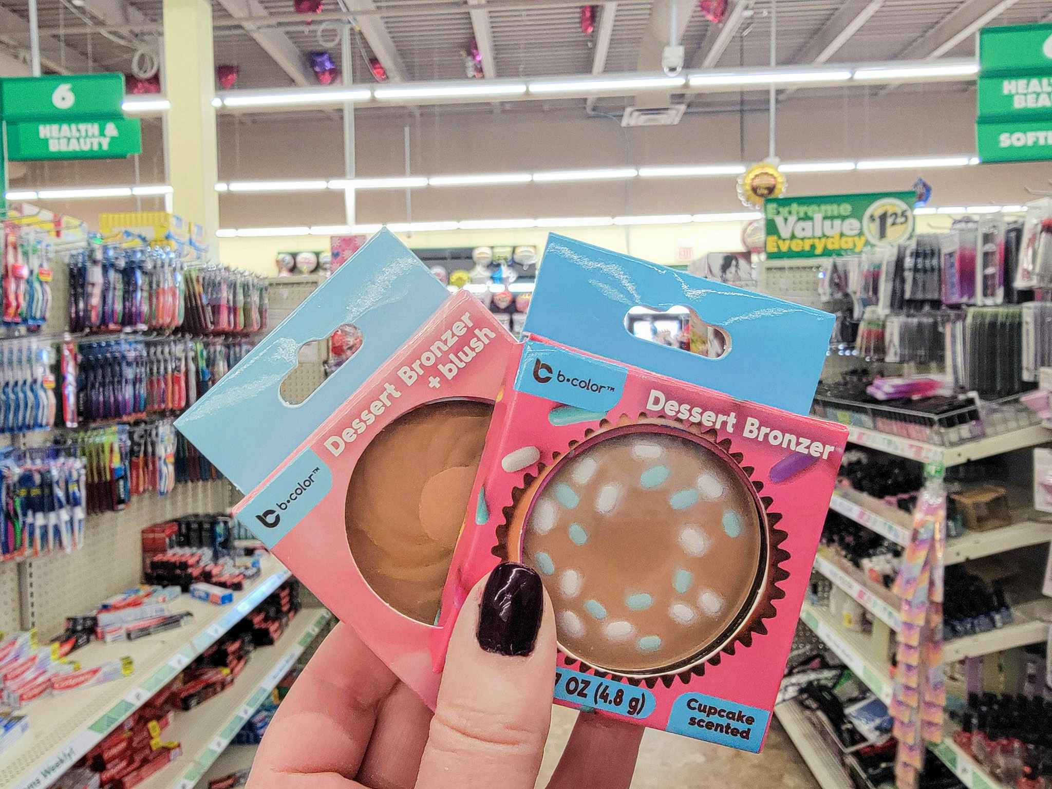 hand holding 2 bronzers