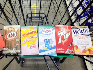 various drink powder mixes in a dollar tree cart