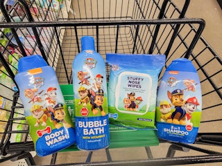 paw patrol body wash, bubble bath, nose wipes, and shampoo in a cart