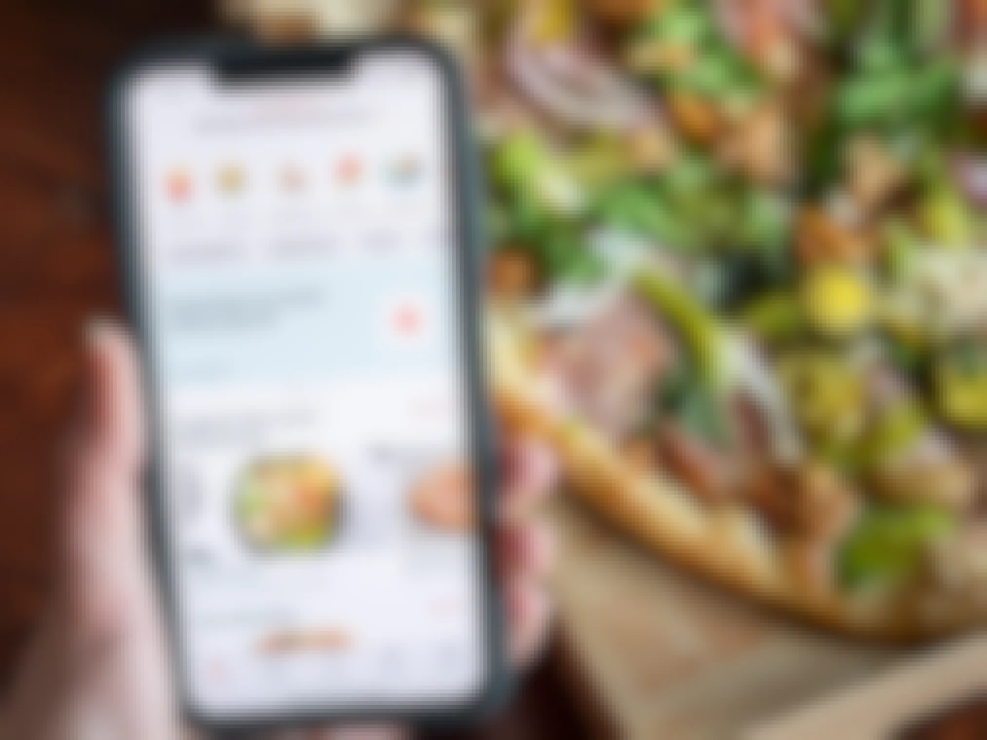 Doordash app open on iphone in front of a pizza