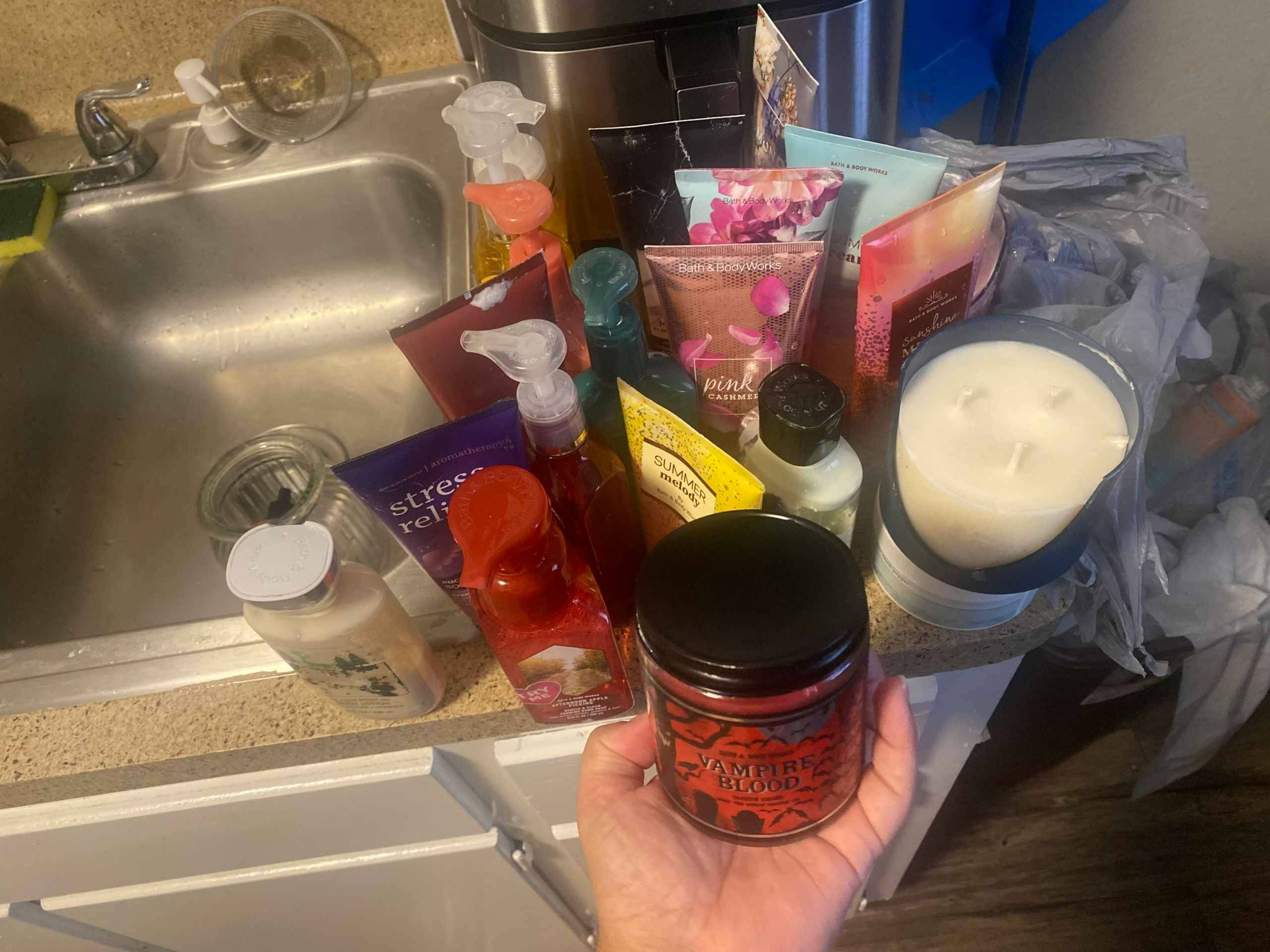 A collection of items retrieved from a Bath & Body Works dumpster