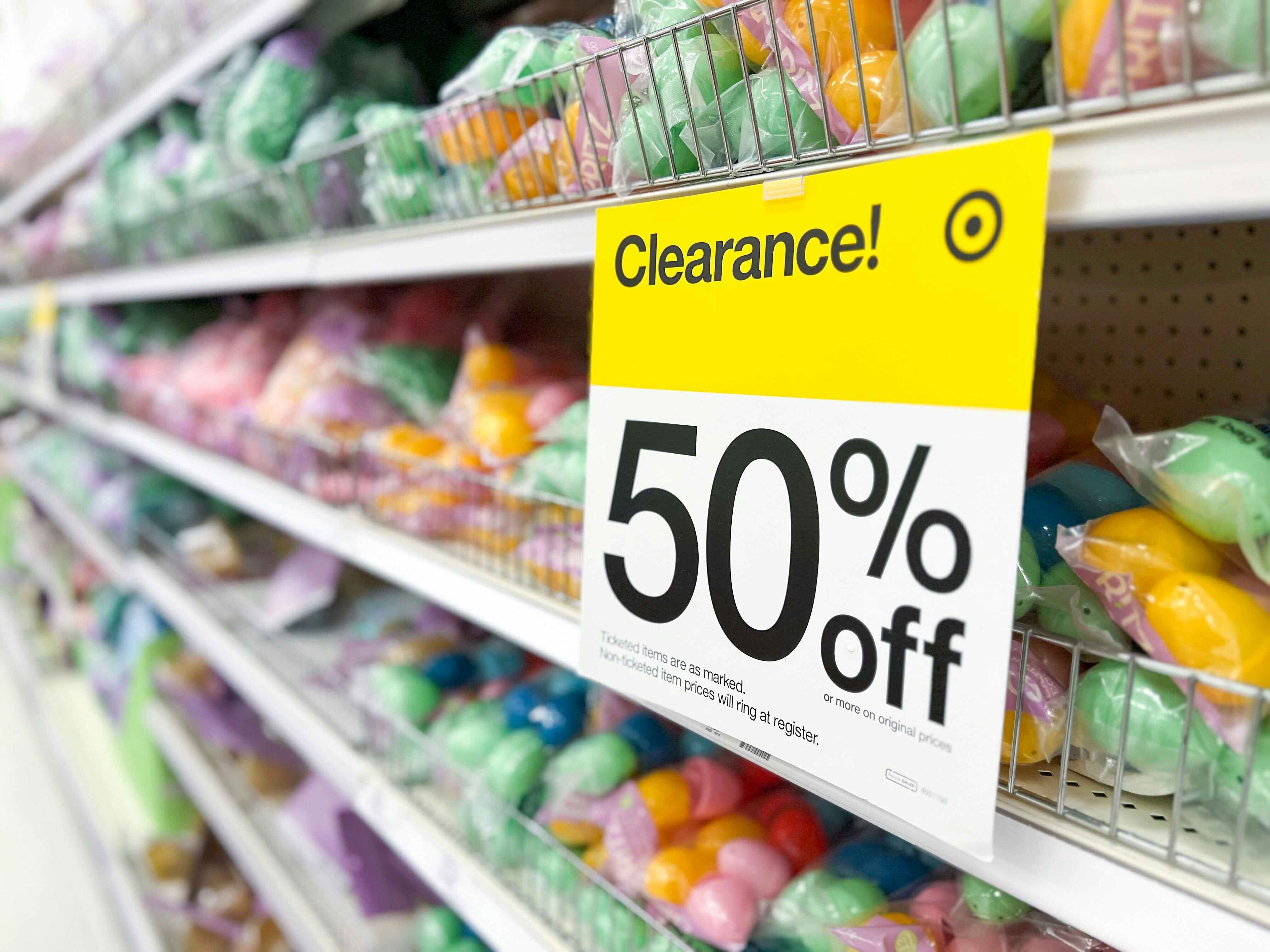 A target shelf full of Easter clearance items with a 50% off clearance sign on the shelf