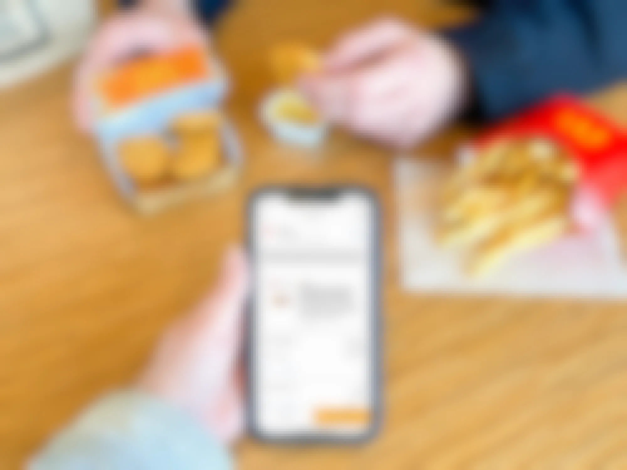 free mcdonalds six-piece chicken mcnuggets with screenshot of offer on iphone