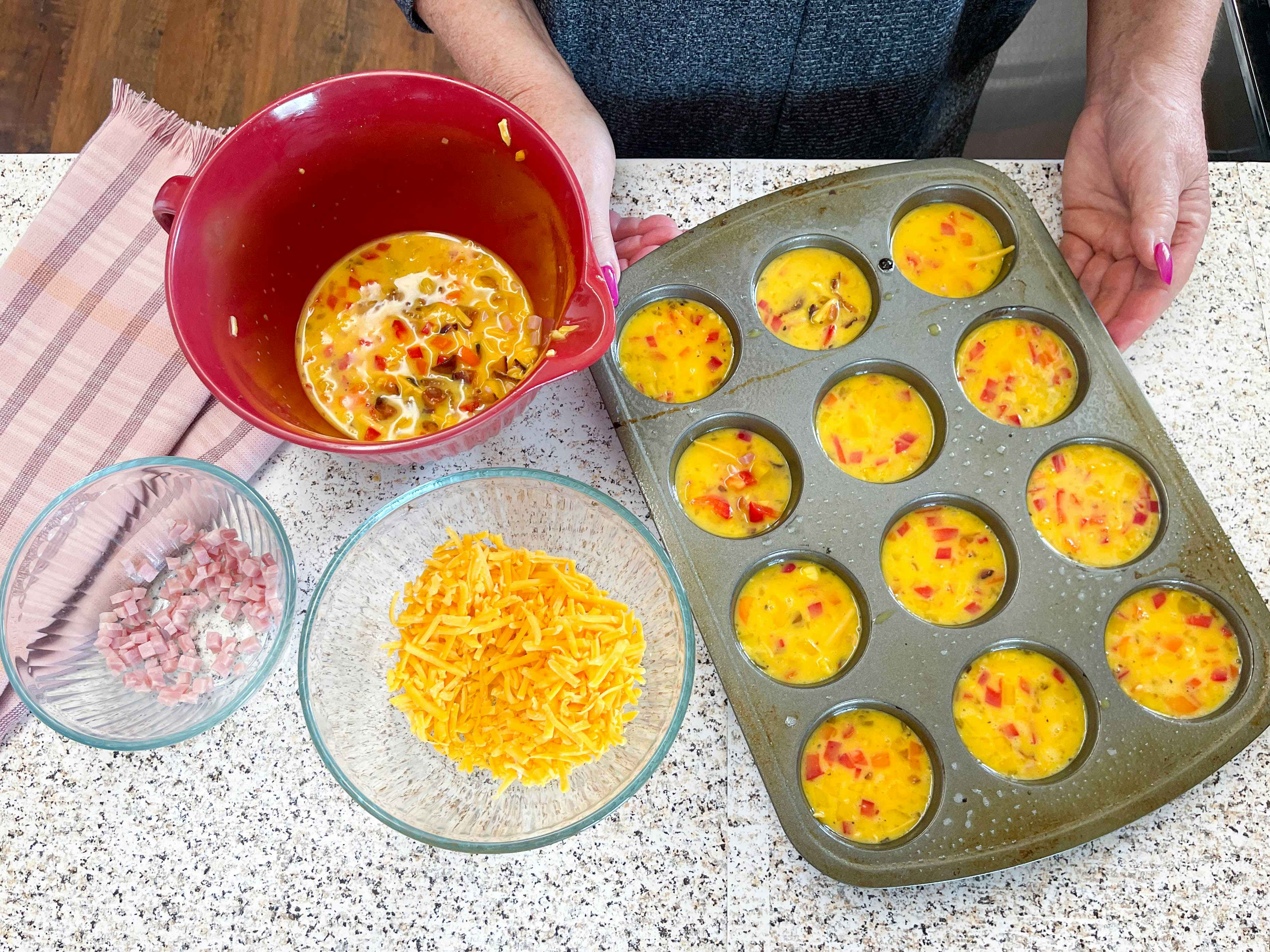 a person making egg muffins 