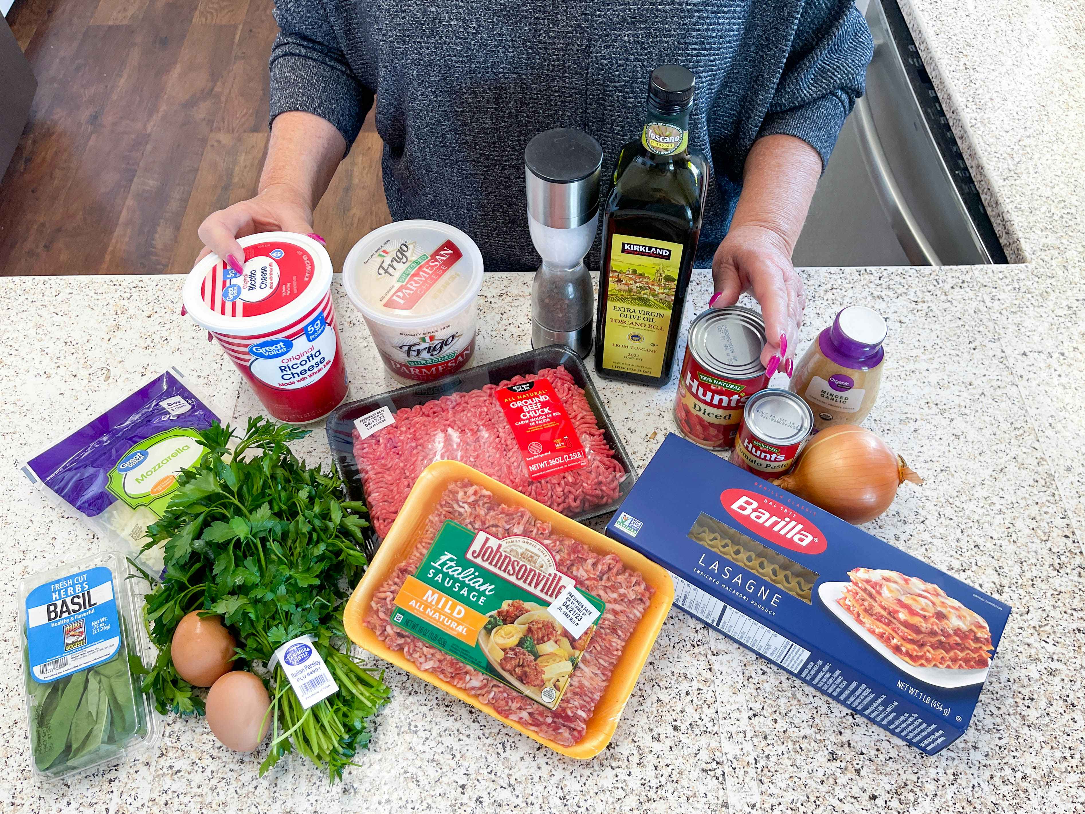 Ingredients on a counter with a person ablout to make a meal 