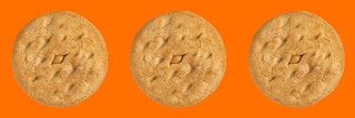 Three Girl Scout Do-Si-Dos cookies on an orange background