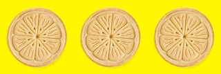 Three Girl Scout Lemonades cookies on a yellow background