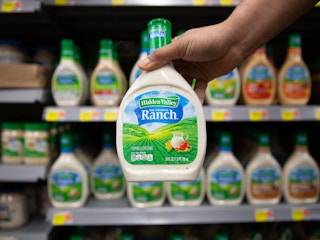 Hand holding Hidden Valley Ranch dressing inside a Walmart