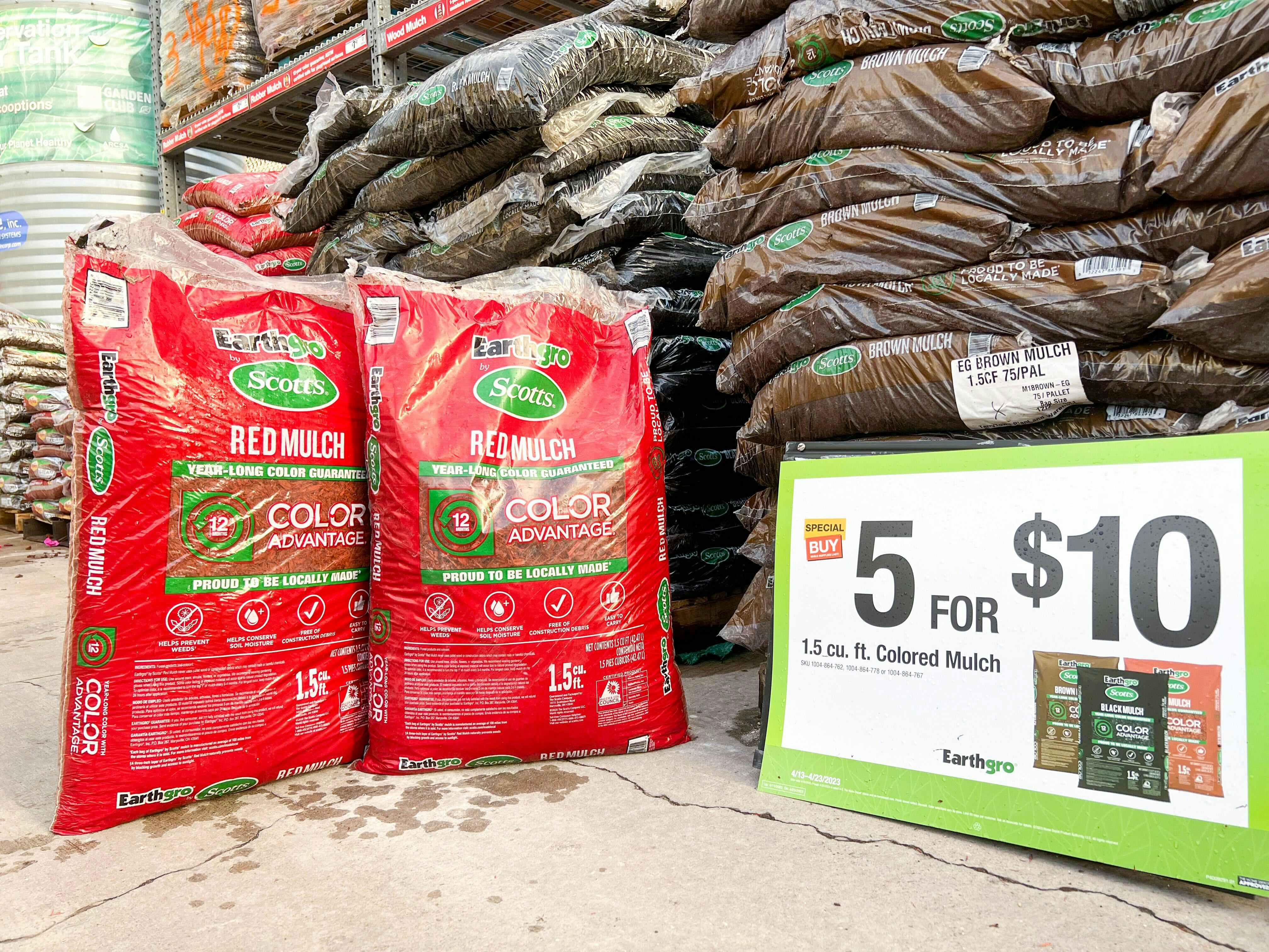bags of home depot colored mulch with sign showing five for $10