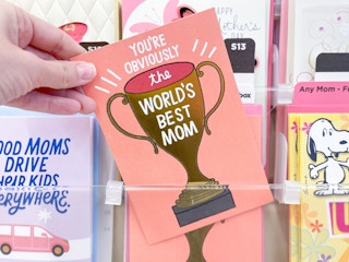 hand picking up hallmark card