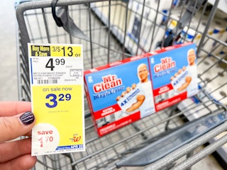 hand holding price sign next mr clean magic erasers