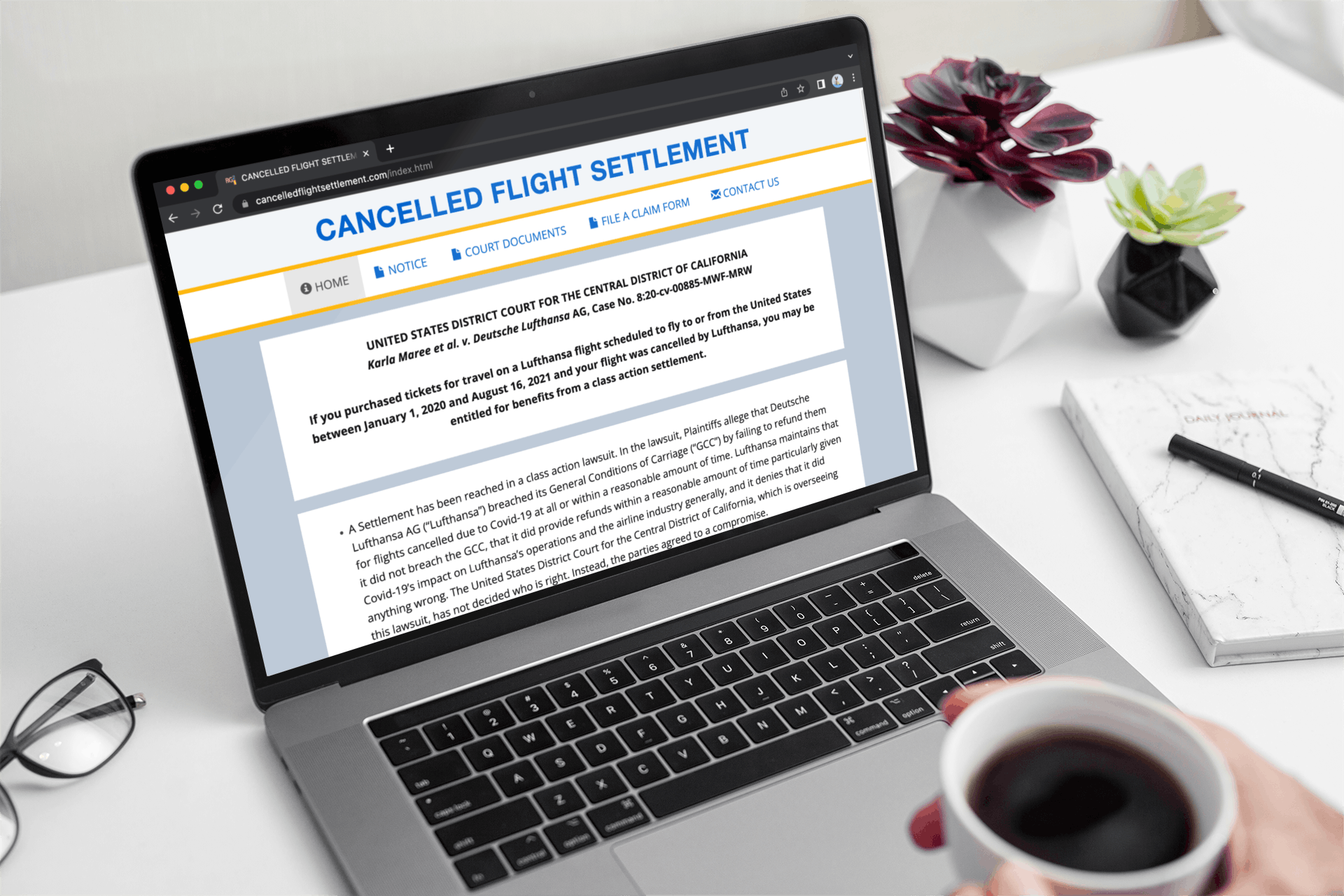 Someone looking at the Lufthansa settlement page on a laptop
