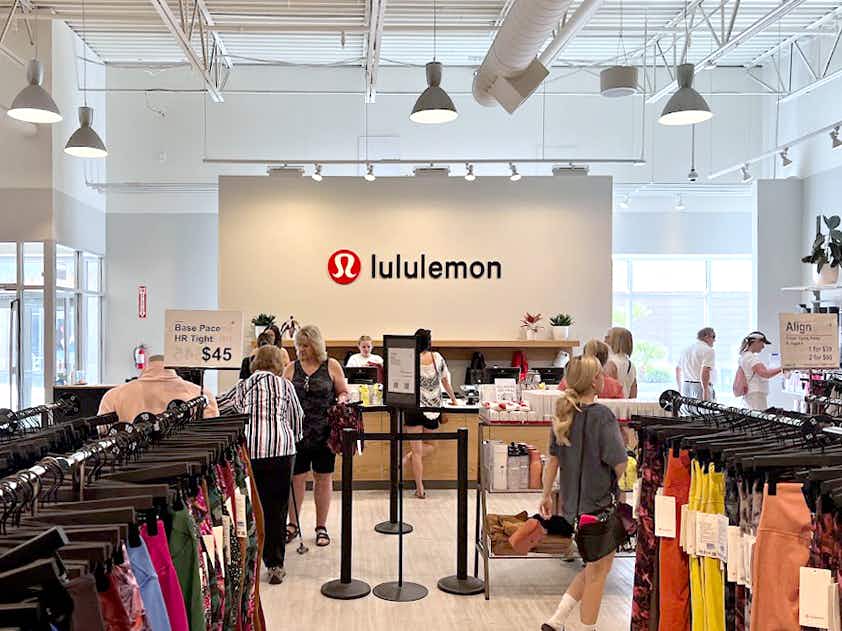 people shopping and checking out at lululemon outlet store