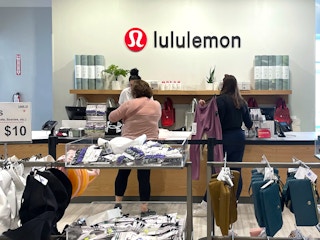 people checking out at lululemon outlet store
