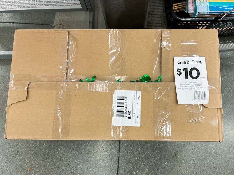 cardboard box labeled "$10 grab bag" in stores at michaels