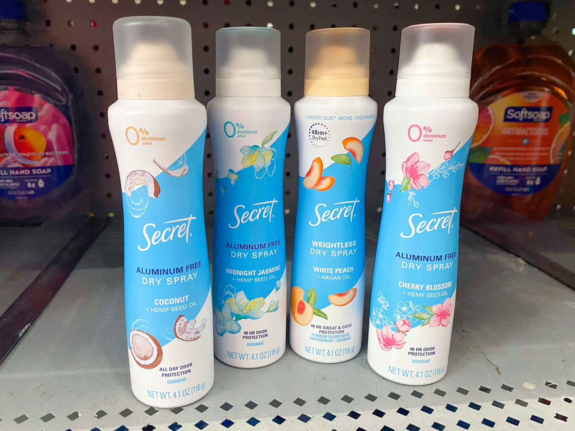 Some Secret Dry Spray deodorants on a Walmart shelf