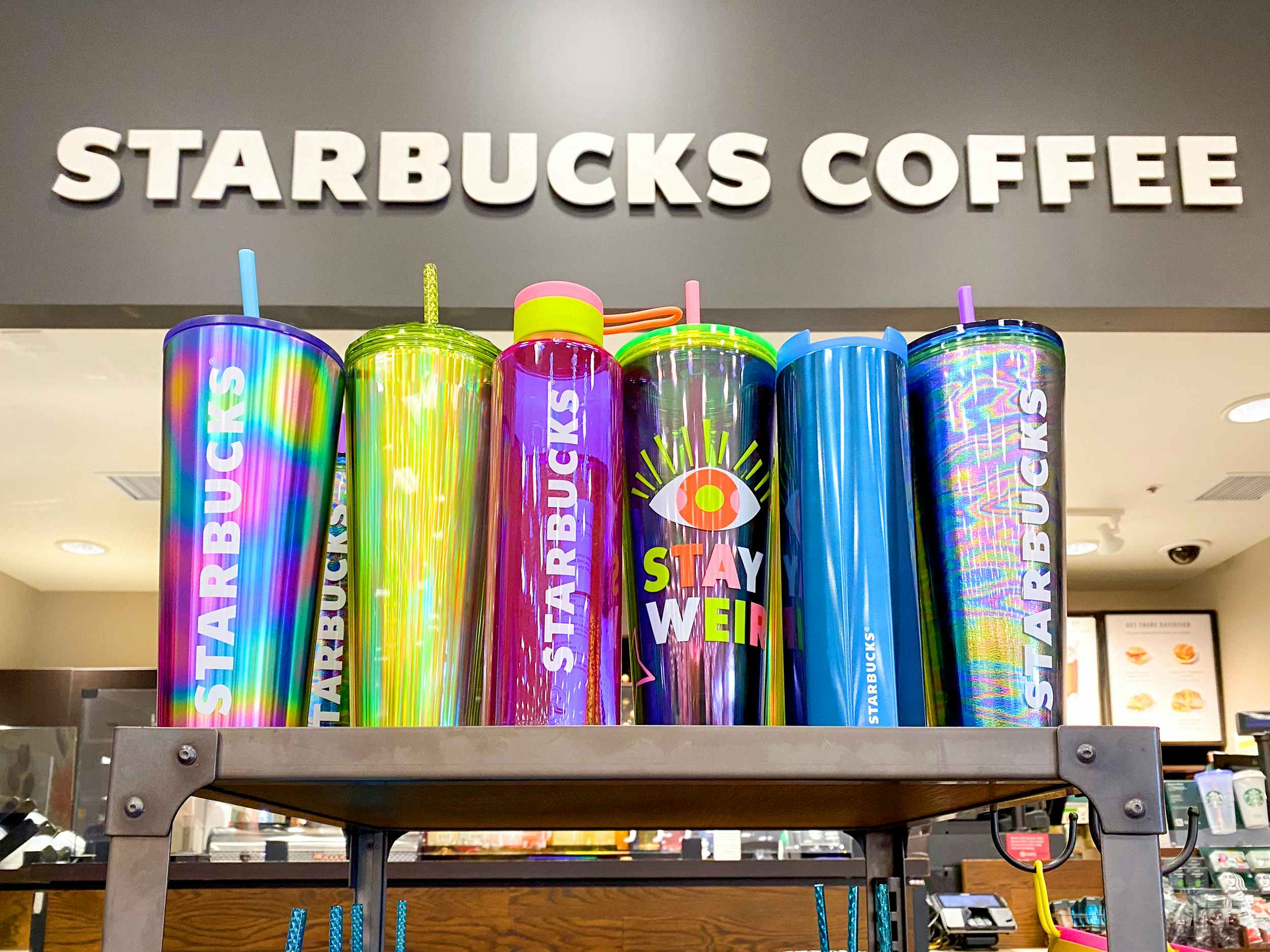 july 2023 summer starbucks cups and tumblers on shelf