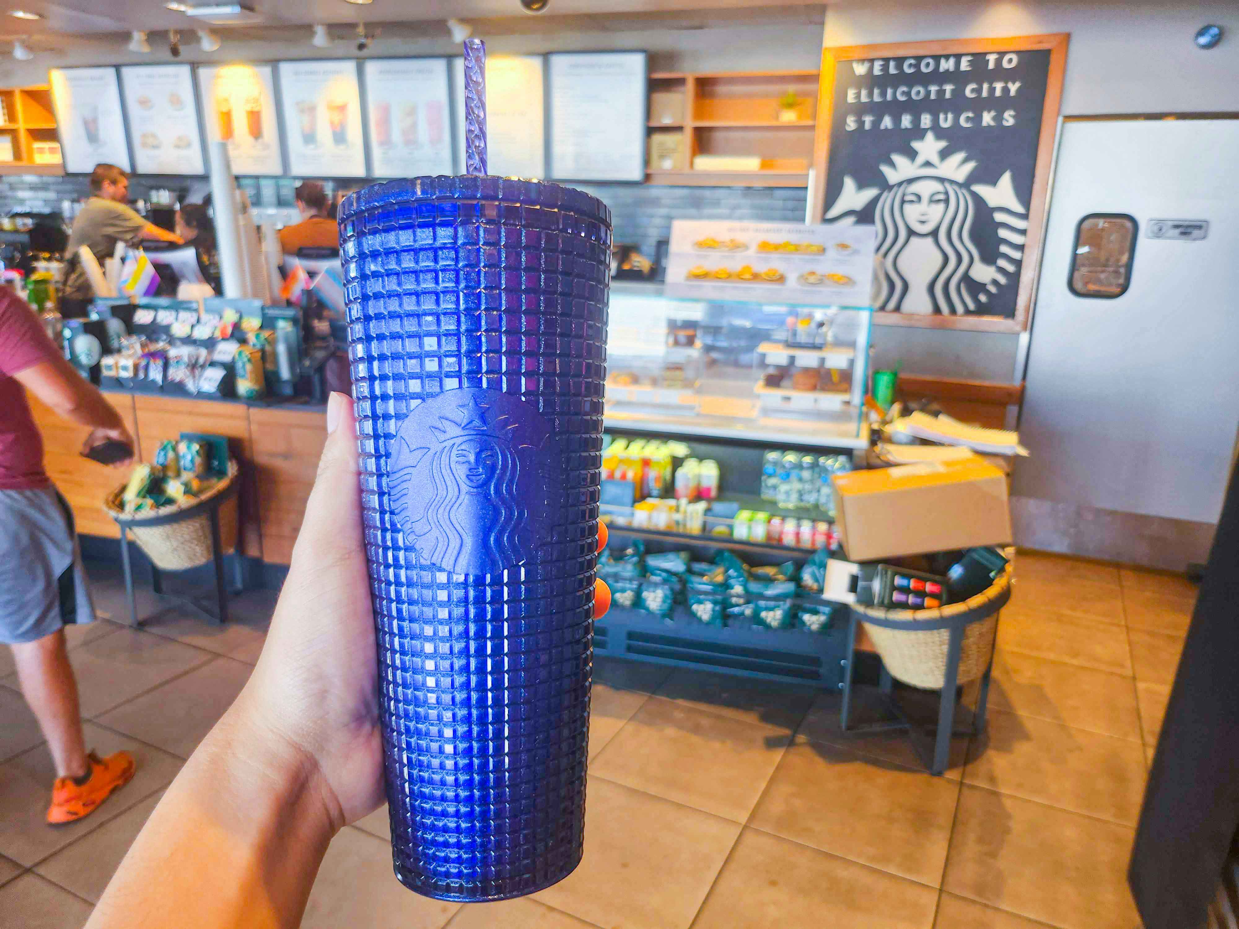 Cobalt hand holding a Cold Cup from starbucks 