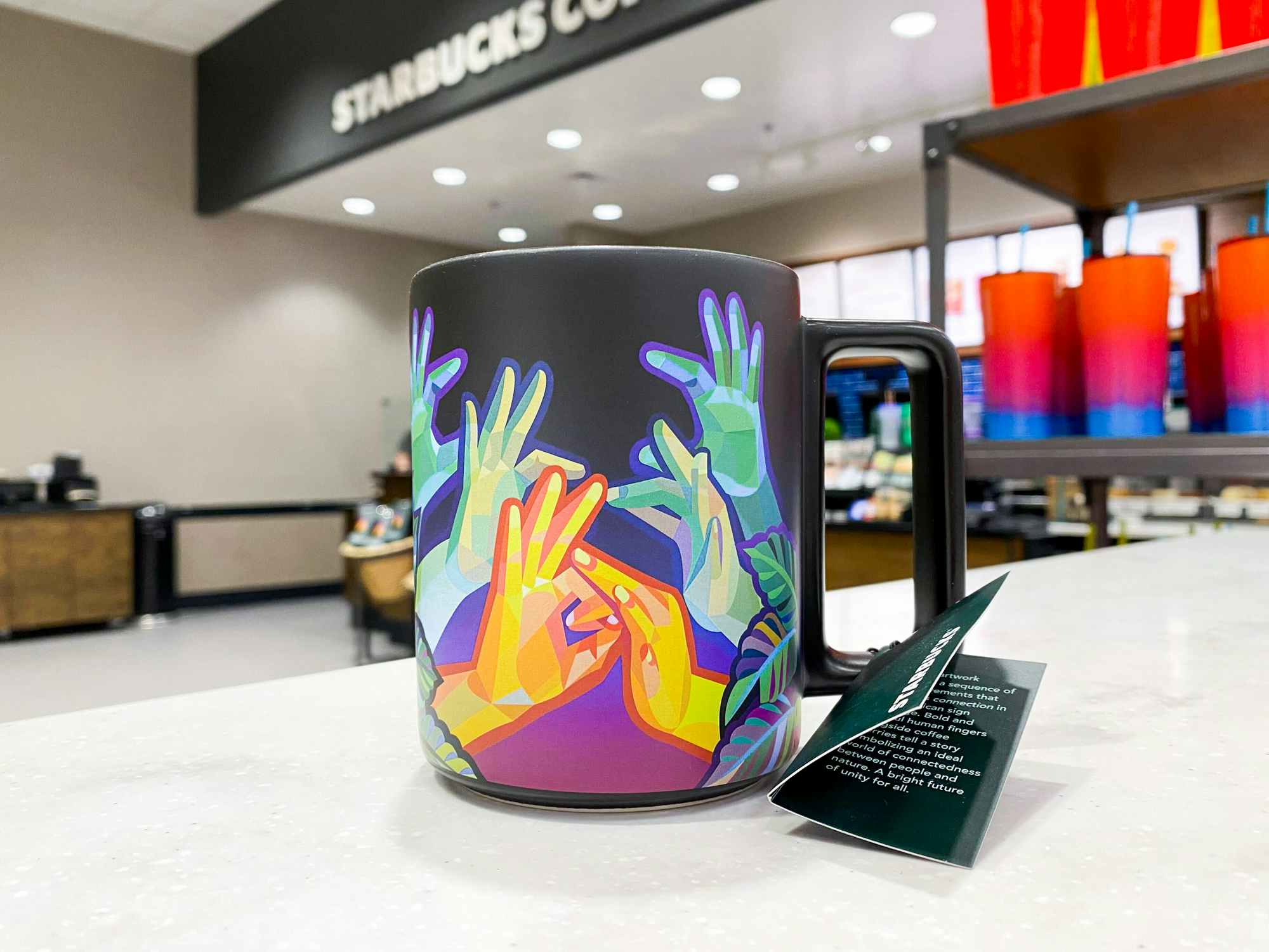 A Starbucks summer cup on the shelf at Starbucks