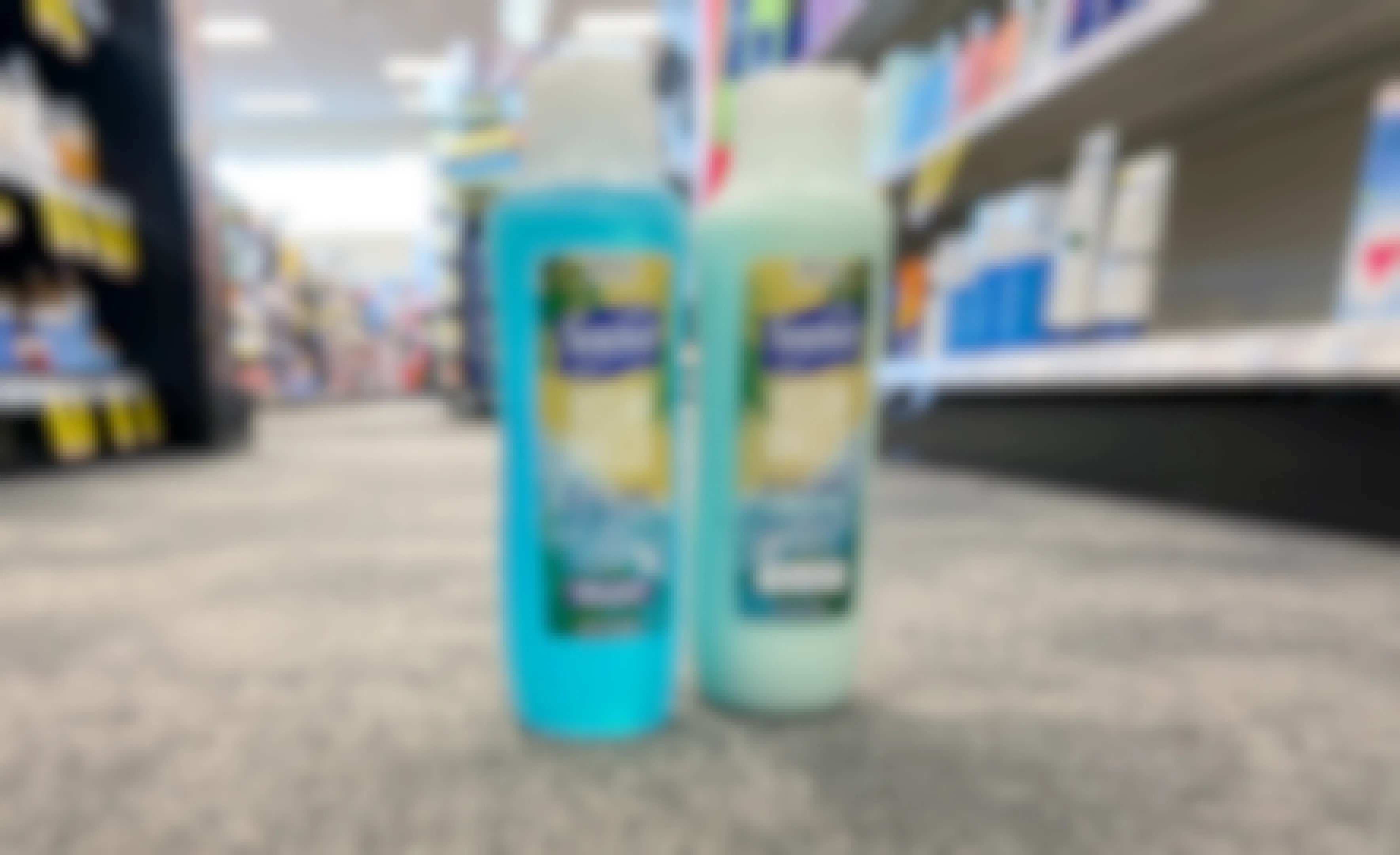 two bottles of suave essentials hair care on the floor at cvs