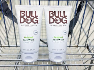 two bottles of bulldog skincare face wash in a cart