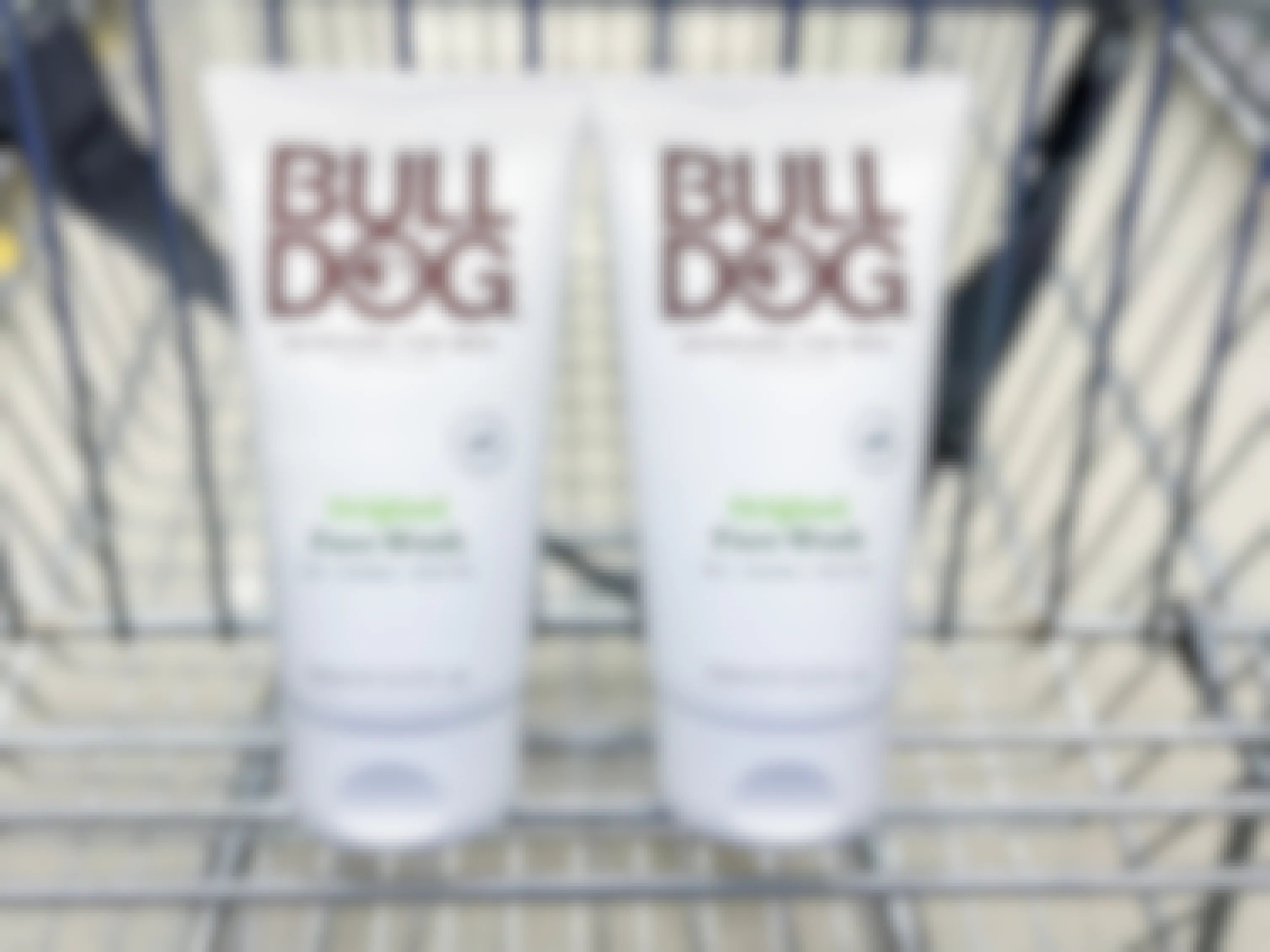 two bottles of bulldog skincare face wash in a cart
