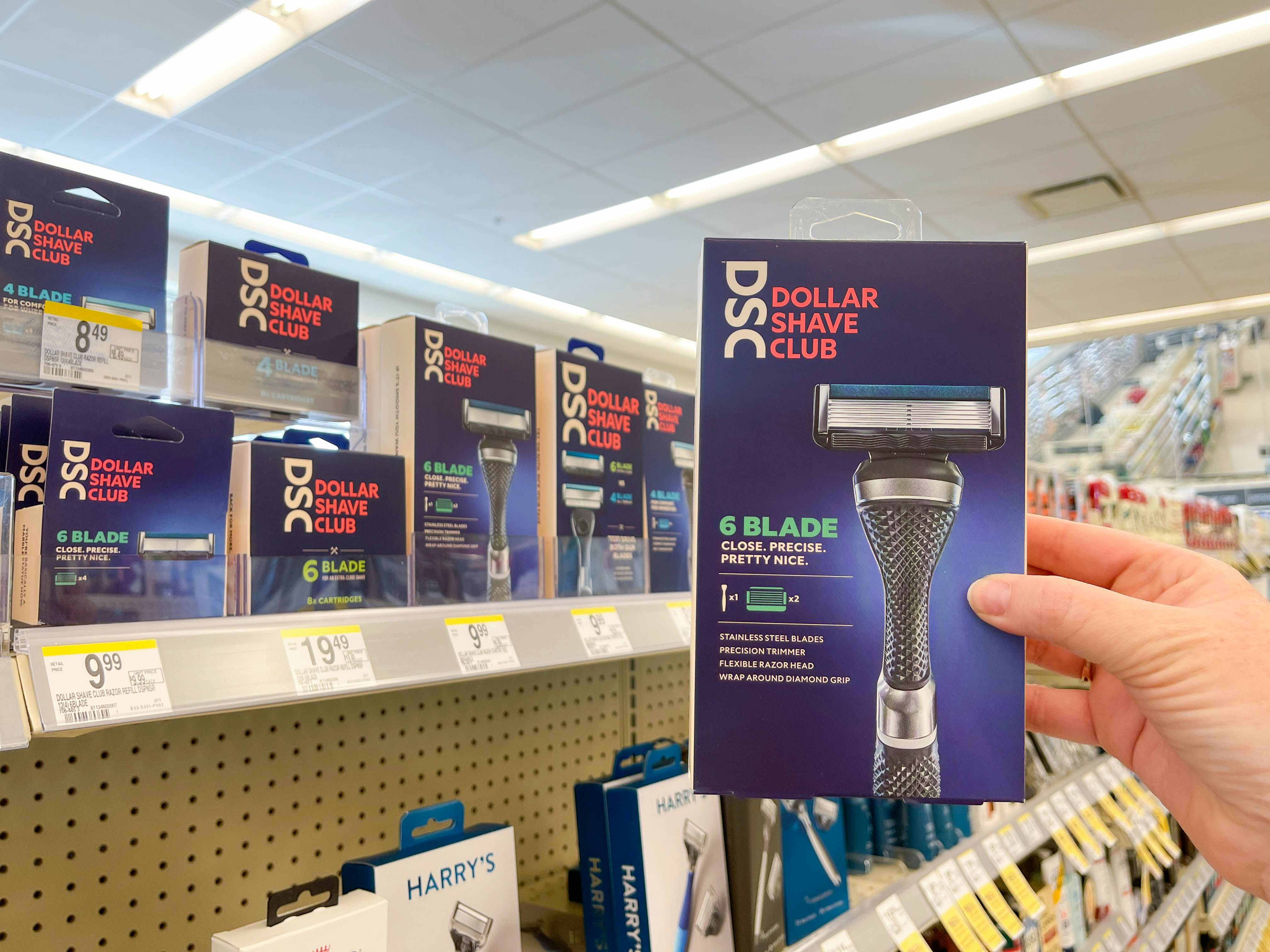 Dollar Shave Club razor box being held in Walgreens