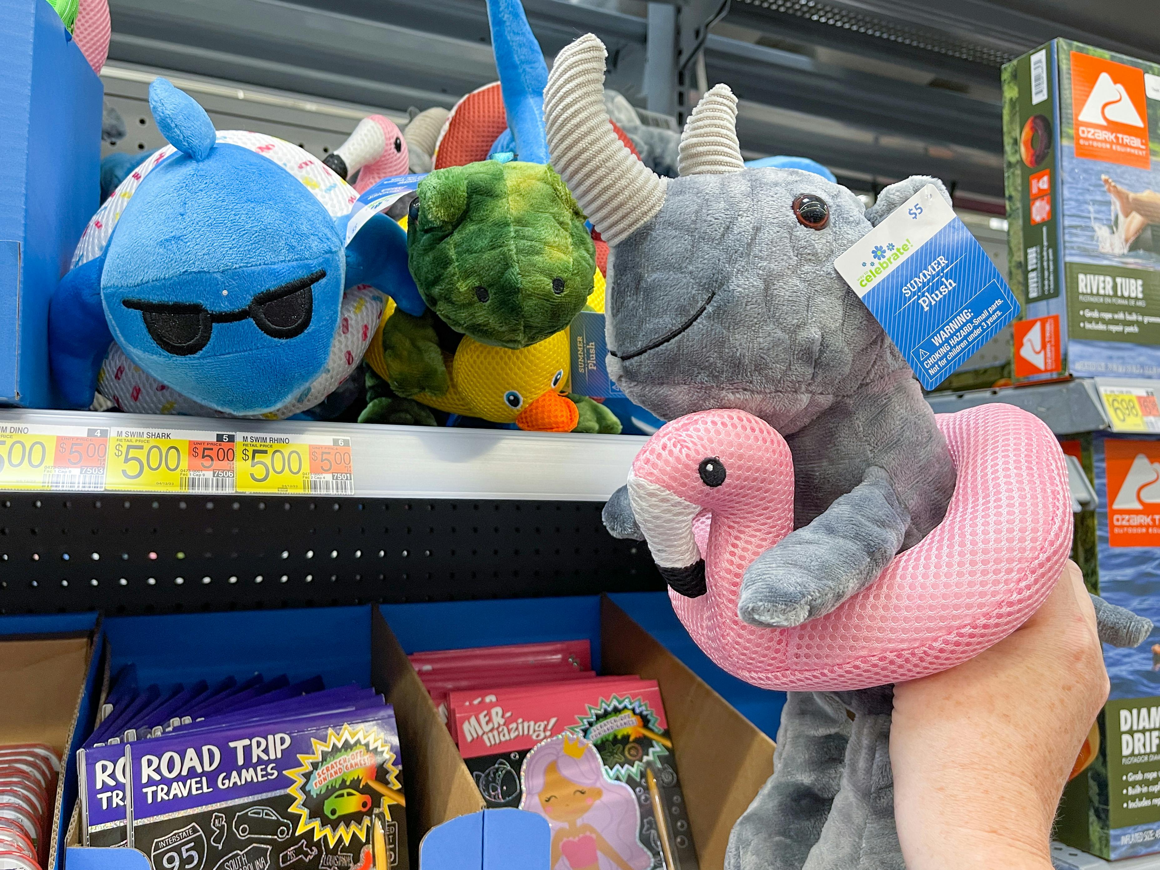 a walmart cart filled with summer pluhes