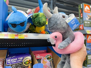a walmart cart filled with summer pluhes