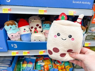 a walmart cart filled with summer pluhes