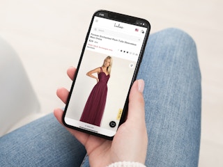 a person looking at the lulus website on their iphone