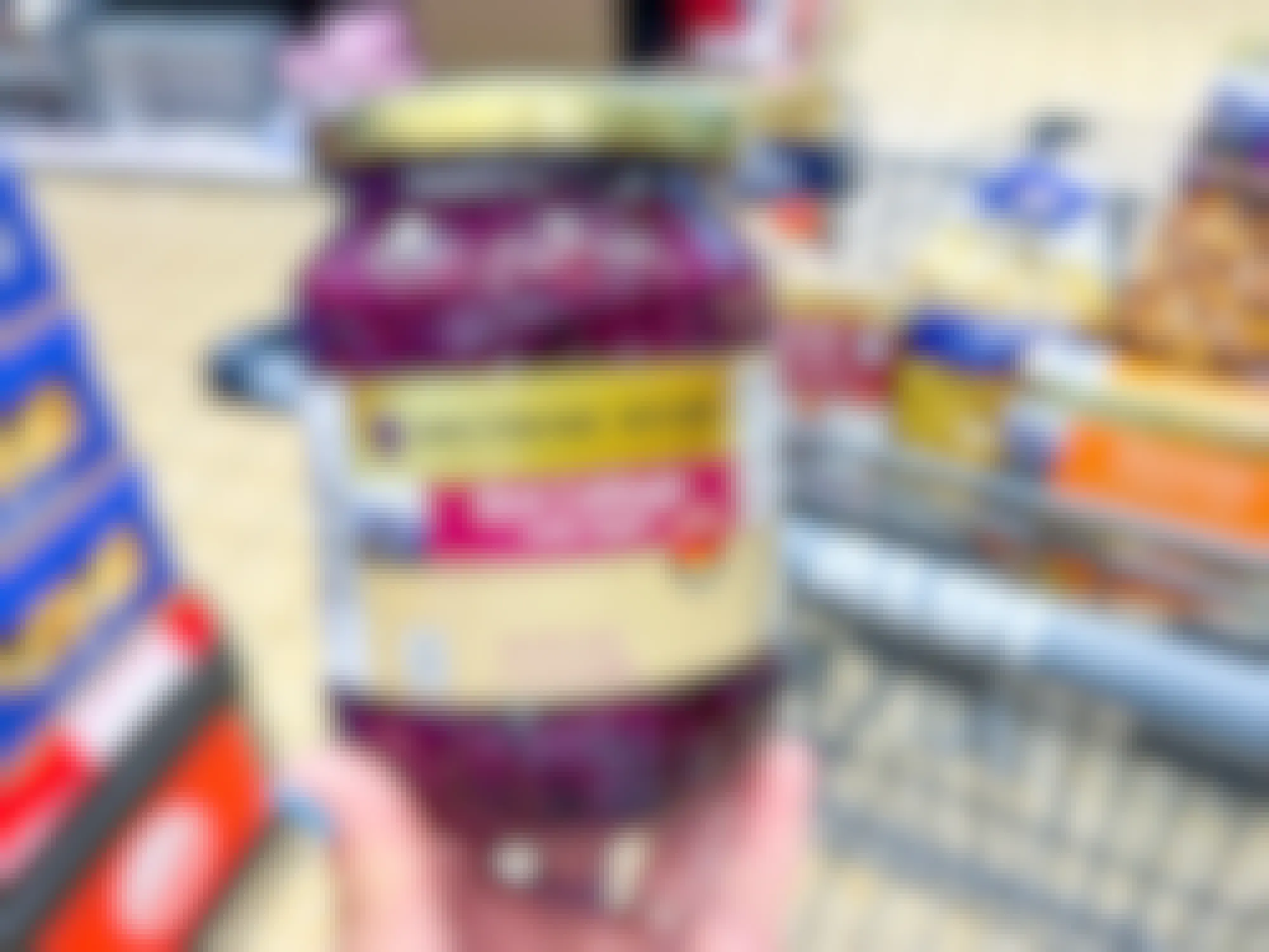 Someone holding a jar of red cabbage with apple at Aldi