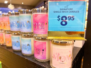 single wick candles on shelf at bath & body works