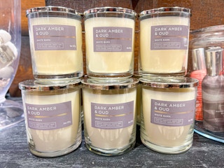 single wick candles on shelf at bath & body works