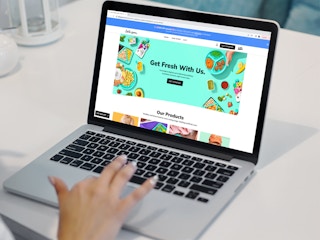 a person looking at the little spoon website on their macbook