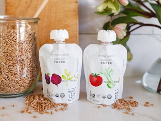 two white leaf provision pouches sitting on a countertop