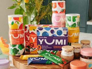 yumi baby food products sitting on a table